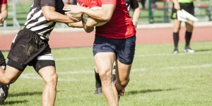 Two rugby players during the game
